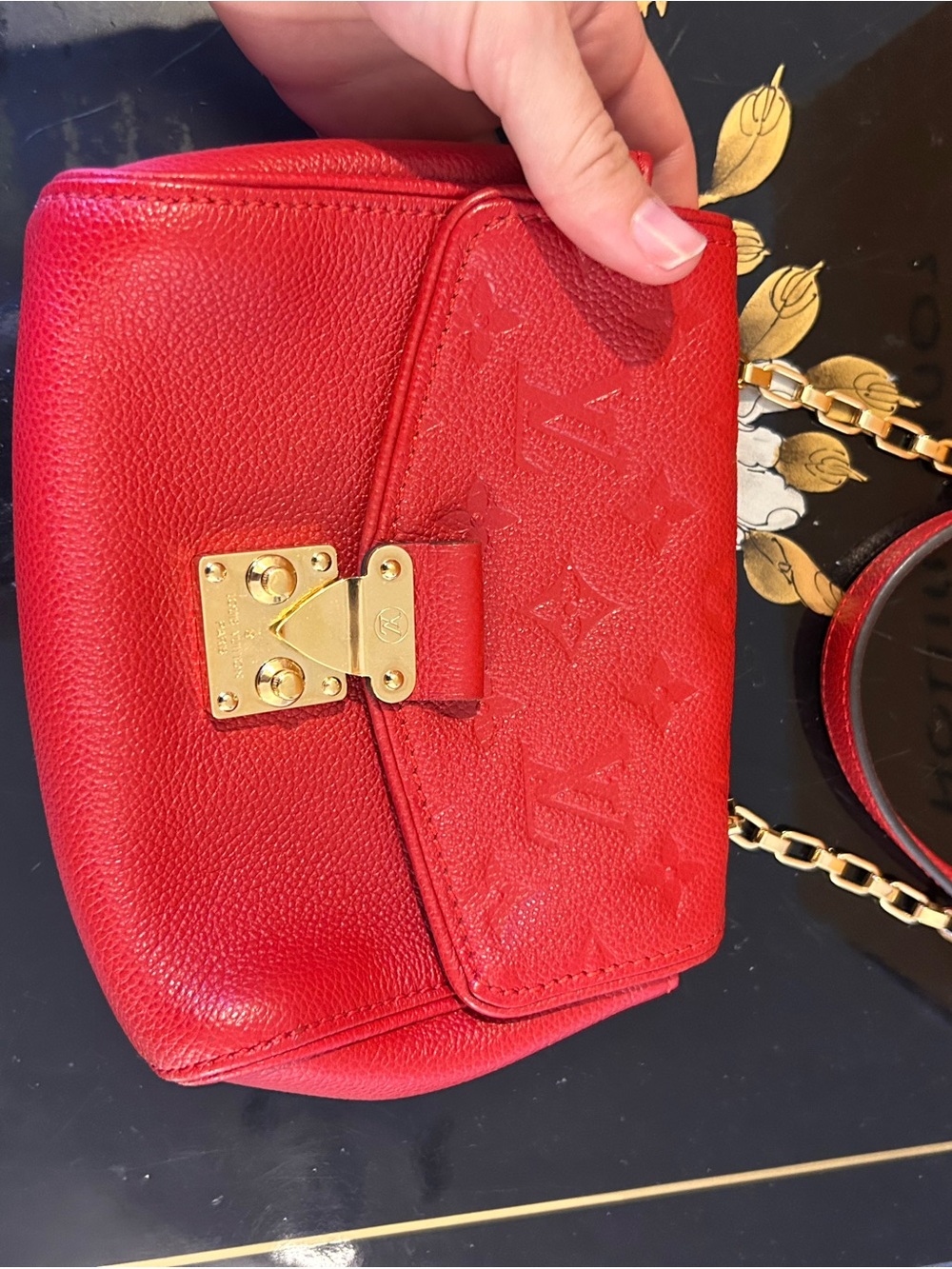 LOUIS VUITTON
Cerise Monogram Empreinte Leather St Germain BB Bag
